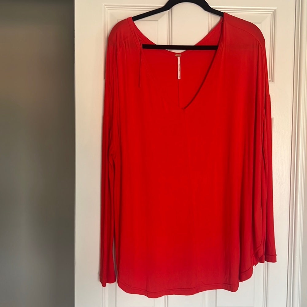 Free people brunt orange oversize blouse with fitted sleeve